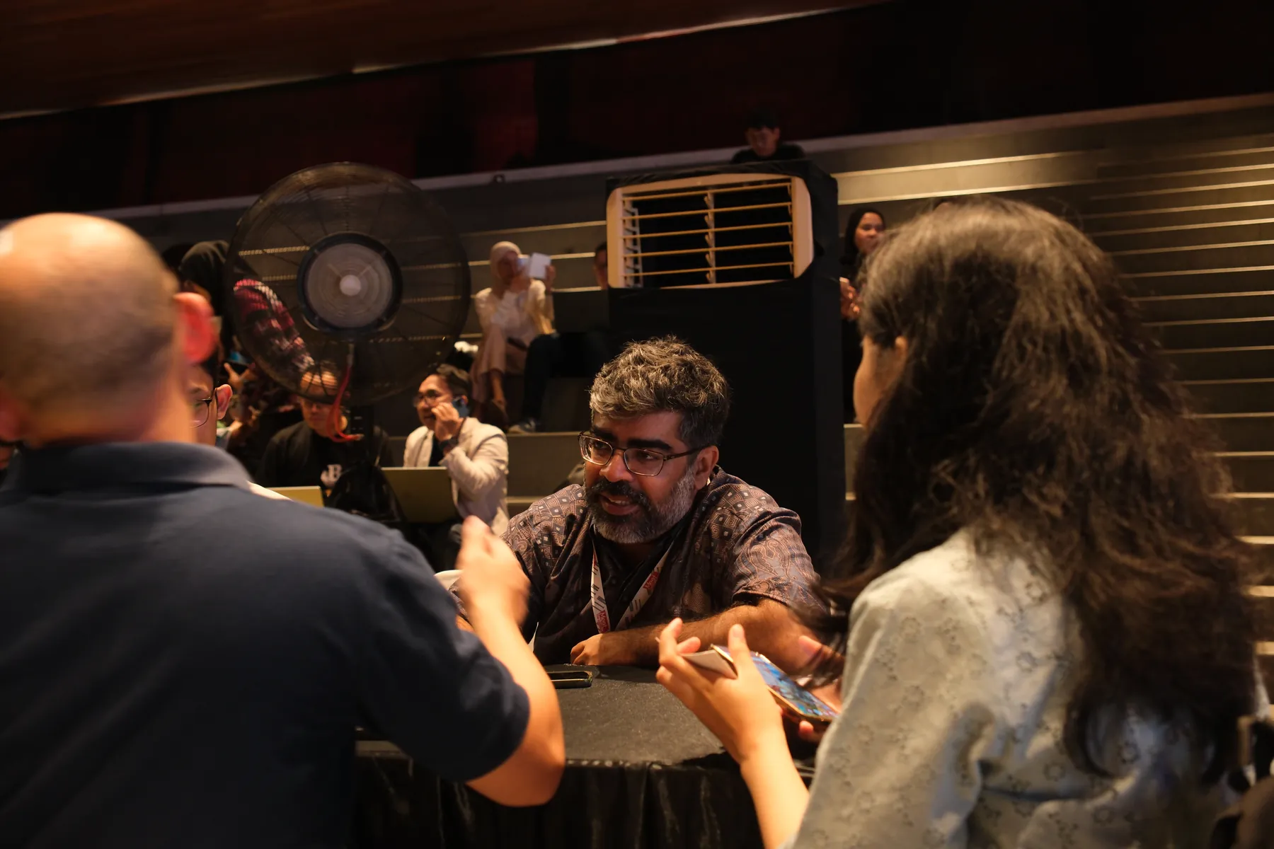 An investor and a founder talking at a table